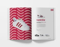 an open book with red and white shoes on the cover, next to a pair of adidas sneakers