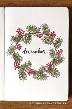 a christmas card with pine branches and berries on it that says, december written in black ink