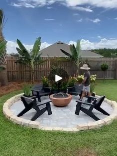 a man standing in the middle of a yard with chairs and a potted plant