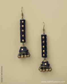 two pairs of earrings with bells hanging from them