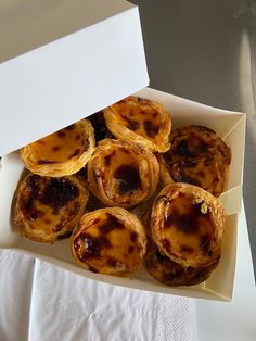 a box filled with pastries sitting on top of a table