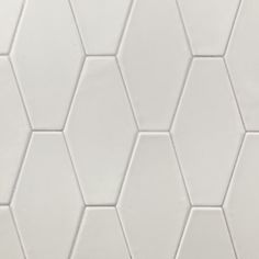 a white hexagonal tile pattern that looks like it has been made out of ceramic