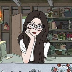 a woman with glasses is looking at the camera in front of a shelf full of clutter