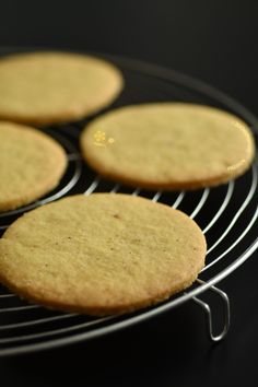 four cookies cooling on a wire rack