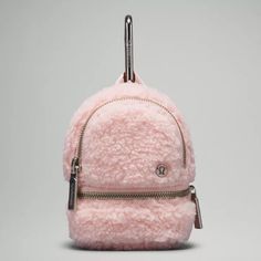 Brand New With Tags Attached Lululemon Athletica City Adventurer Fleece Backpack Nano Asia Exclusive Color: Pink Mist Silver Tone Hardware It's The Little Things. Keep Them Close With This Nano Version Of Your Favourite Backpack. Clip It Onto A Pack Or Slide It Through A Belt-Bag Strap For An Extra Dose Of Storage. Dimensions: 8.5cm X 6cm X 12cm (3.3" X 2.3" X 4.7") Textured, Fleece Fabric Materials Liner:Face: 100% Recycled Polyester Body:70% Polyester, 30% Recycled Polyester Ll8 Backpack Lululemon, Lululemon Backpack, Girly Christmas Gifts, Mist Color, Preppy Inspiration, Backpack Keychains, Wacky Hair, Running Hats, Knit Mittens