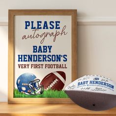 a baby's first football is next to a framed poster