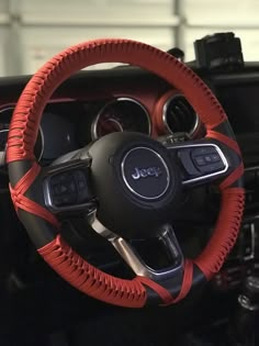 the steering wheel cover is red and black