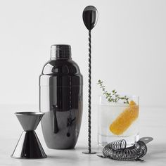 an assortment of cocktail accessories including a drink dispenser