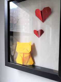 origami cats and hearts in a shadow box