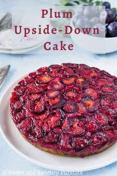 plum upside down cake on a plate with the words plum upside down cake above it