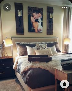 a bedroom with two framed pictures above the bed