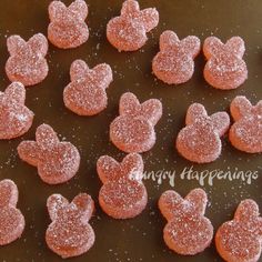 there are many heart shaped cookies on the pan