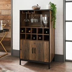 a wooden cabinet with wine glasses on top