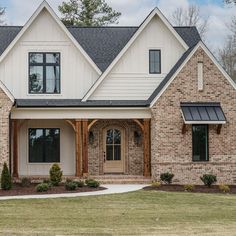 a large brick house with two story windows