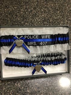 the police wife bracelets are packaged in a gift box with ribbon and heart charm