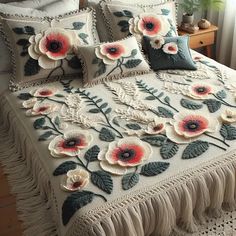 a bed with white and red flowers on it