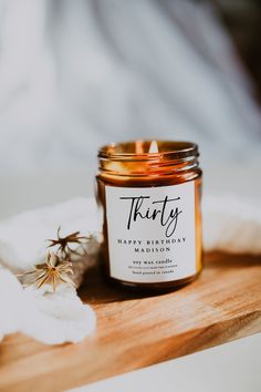 a candle sitting on top of a wooden table