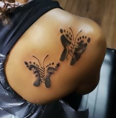 a woman's back with two footprints on it