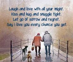 two people walking down a rain soaked path with their dogs and the caption says, laugh and love with all your might kiss and hug and snuggle tight