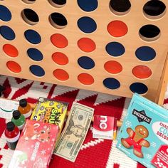 an image of a game board with money on the floor and other items around it