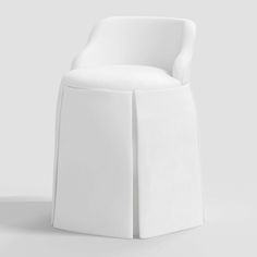 a white chair sitting on top of a white floor