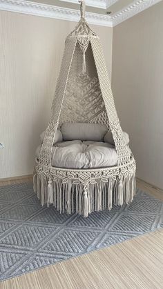 a hammock hanging from the ceiling in a room