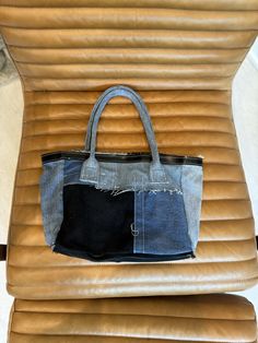 Upcycled custom denim tote bag -- superior denim utilized and custom made. Blue Denim with Genuine Brown leather bottom and Italian leather black brim. Rolled denim handles. Custom Denim, Denim Tote Bags, Denim Tote, Hand Bag, Italian Leather, Leather Tote, Brown Leather, Blue Denim, Custom Made