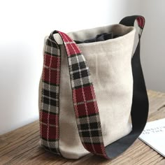 a tote bag sitting on top of a wooden table