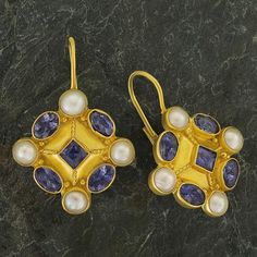 This design is poetic testament of the genius of creativity. A central faceted iolite in a diamond-shaped setting is surrounded by cultured pearls and a quartet of iolite stones. 24k gold over sterling silver. European backs for pierced ears. Size: 1 1/4 inches. Byzantine Earrings, Ancient Roman Jewelry, Byzantine Jewelry, Iolite Stone, Ancient Jewellery, Lapis Earrings, Art And Literature, Zirconia Earrings, Fantasy Jewelry