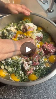 someone is mixing food in a pot on the kitchen counter with their thumbnails