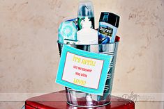 a red suitcase with some personal care items in it and a sign on the lid