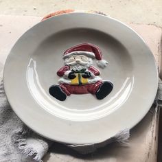 a white plate with a santa clause on it