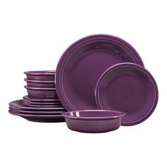 purple dinnerware is stacked on top of each other