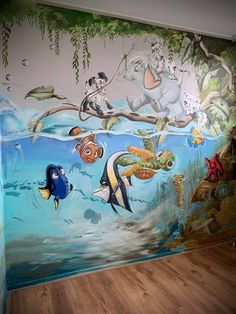 this is an image of a children's room with fish and sea animals painted on the wall