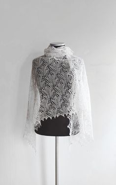 Beautiful light and delicate handknit triangular lace shawl. Slightly asymmetrical. Very feminine and elegant. From a smoke free home. READY TO SHIP Color: ivory Material: 65% merino, 35% rayon Size approx: 73.5" х 35" (185 х 90 cm). Hand knitted, so please treat it gently. Only hand wash cold max 30oC / 86F. Stretch to right measurements and Dry Flat. IF YOU LIKE THE DESIGN, BUT NOT SATISFIED WITH THE COLOR - LEAVE ME A MESSAGE AND I'LL KNIT IT SPECIFICALLY FOR YOU. ღ Lace For You ღ  Estimated Blue Contacts, Lace Wrap, Summer Lace, Wedding Shawl, Wedding Lace, Lace Shawl, Silk Shawl, White Bridal, Lace Weddings