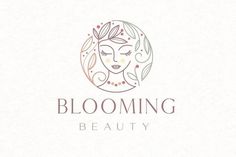 a woman's face with leaves and flowers in her hair logo for a beauty salon