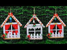 three christmas decorations are hanging on the wall