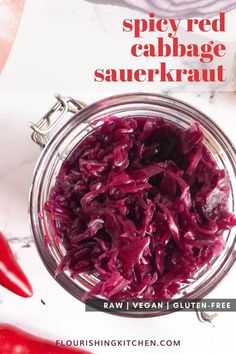 red cabbage sauerkraut in a glass jar on a marble surface with text overlay