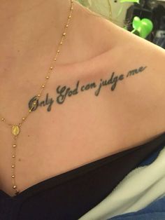 the back of a woman's chest with a tattoo saying, only god can judge me