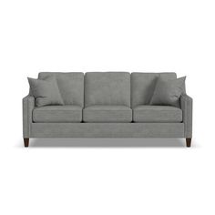 a gray couch with pillows on it