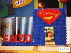 the entrance to an amusement park decorated with legos and superman's caper