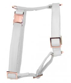 a white and pink harness with metal buckles