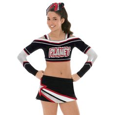 a woman in a black and white cheerleader outfit with her hands on her hips