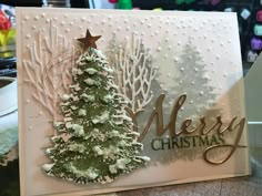 a card with a christmas tree on it