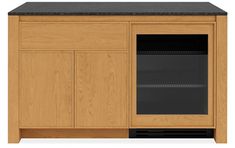 a wooden cabinet with an open door and black counter top on the bottom right side