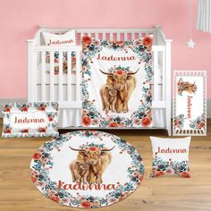 a baby bedding set with an image of a cow and flowers on it, including the name jadonna