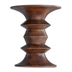 a wooden vase sitting on top of a table