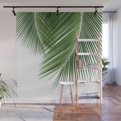 a large palm tree in the corner of a room wall mural