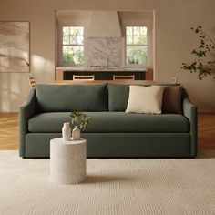 a living room scene with focus on the couch and coffee table in the foreground