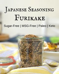 japanese seasoning furikake in a glass jar on a yellow and white towel